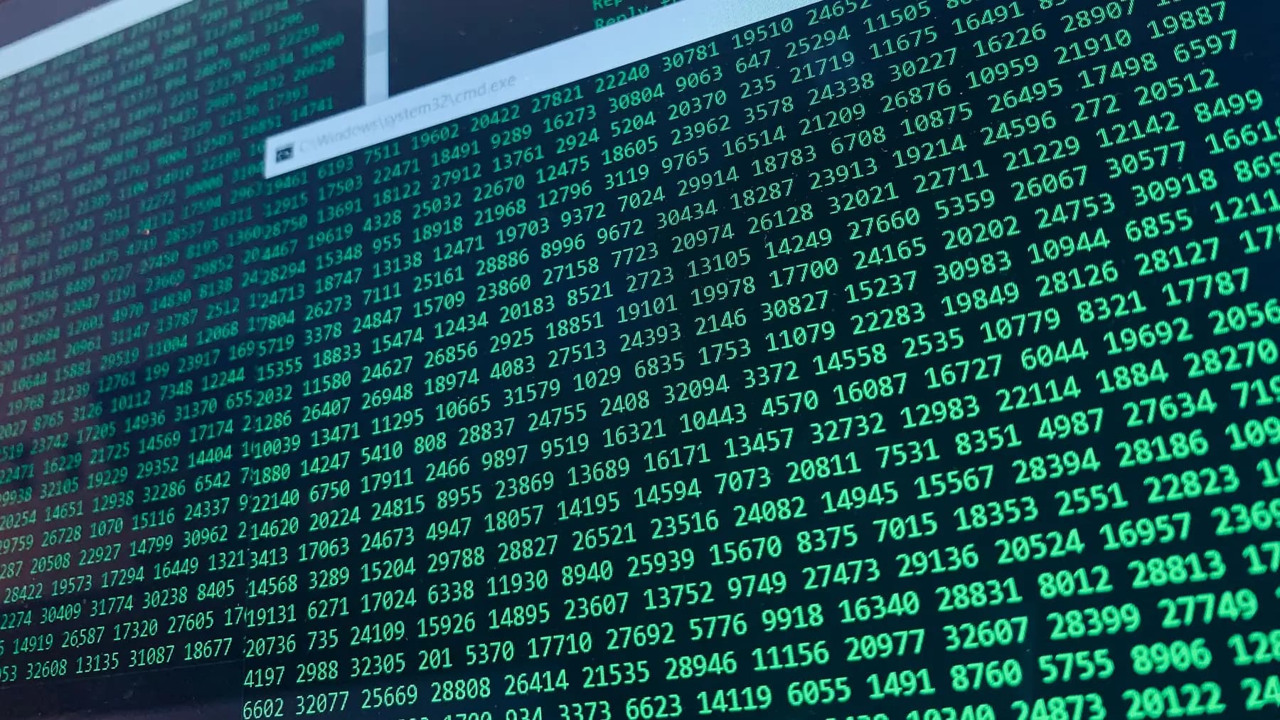 Green code on a dark computer screen