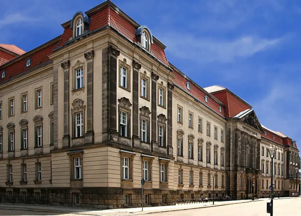Historic university building with a red roof