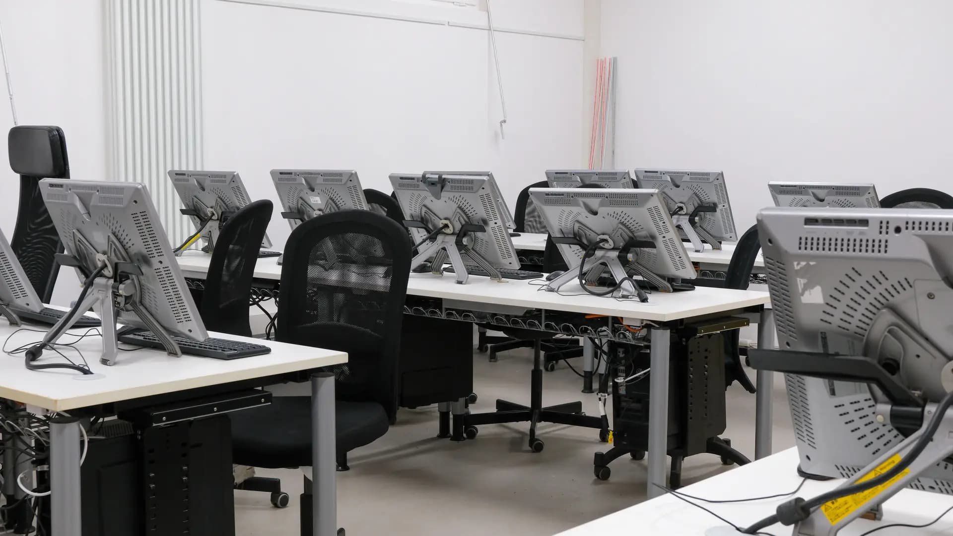 University computer lab with rows of workstations